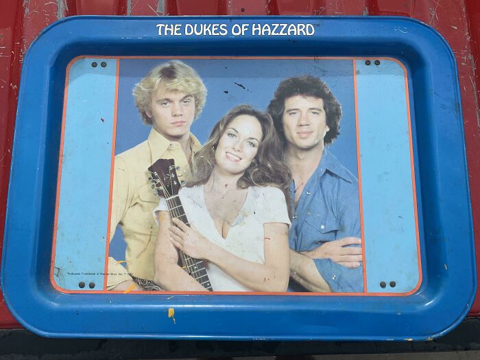 Vintage Dukes of Hazzard tray featuring actors, encapsulating the 1980s vibe with iconic style and nostalgic appeal.