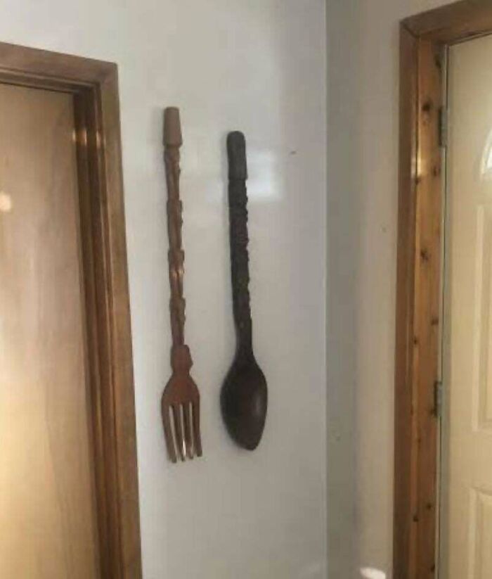 Giant wooden fork and spoon wall decor, capturing the 1980s vibe.