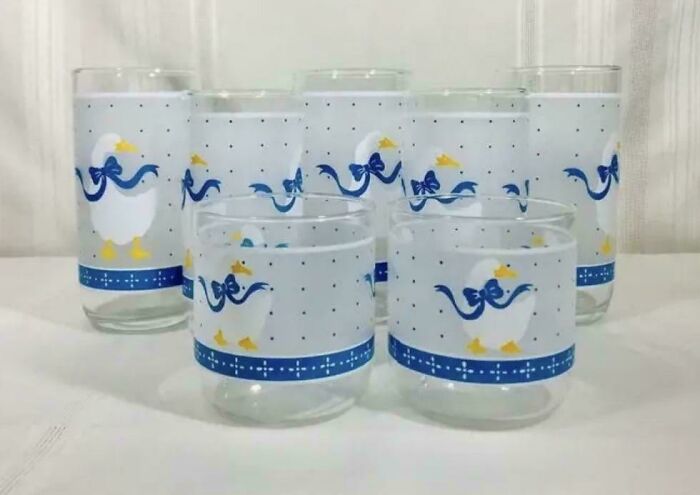 Set of 1980s-style glasses with blue goose design, evoking a retro vibe.