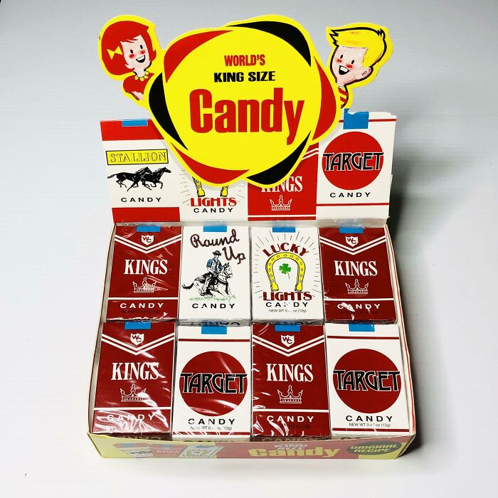 1980s vibe candy display featuring various retro candy cigarette boxes with colorful graphics.