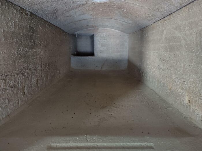 Underground passage with arched ceiling, highlighting iconic hidden spaces around the world.