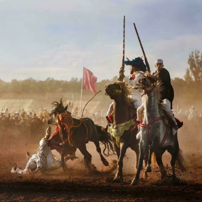 Renaissance masterpiece scene with riders on horseback and dramatic action captured in dusty outdoor setting.