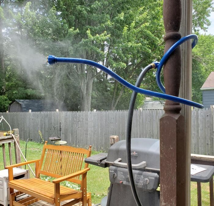 A garden misting hose setup on a backyard patio, perfect for staying cool this spring.