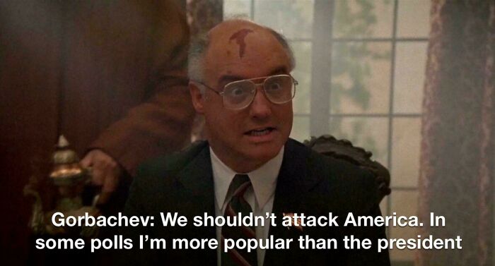 Man in glasses and suit with head injury speaking seriously, representing aged like wine predictions accuracy.