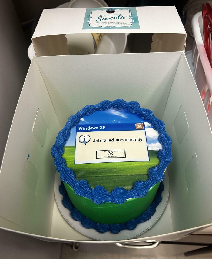Cake with a Windows XP error message saying "Job failed successfully," showcasing passive-aggressive humor.