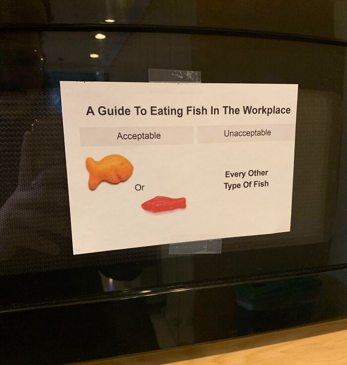 Passive-aggressive workplace sign showing acceptable fish snacks: Goldfish and Swedish Fish candies.