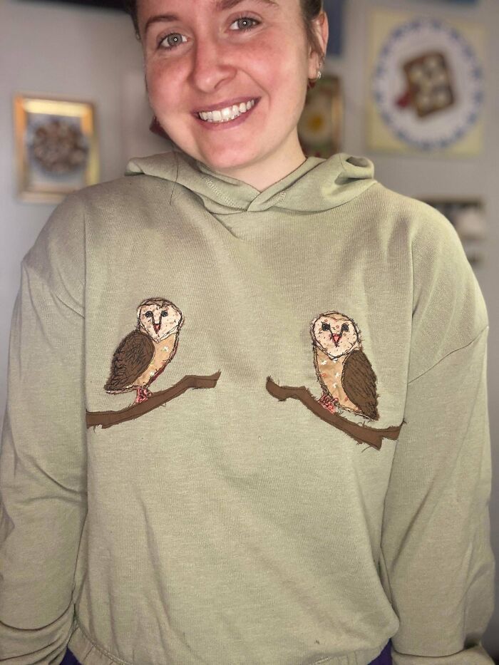Person wearing a hoodie with two embroidered owls on branches, showcasing cool things people made to share with everyone.