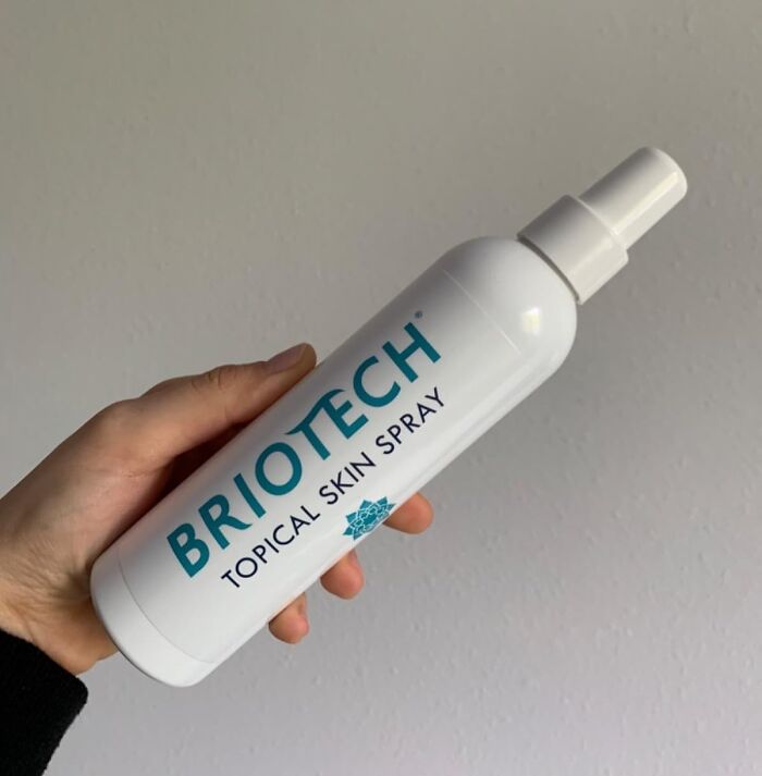 Hand holding BrioTech topical skin spray, one of the exciting new finds.
