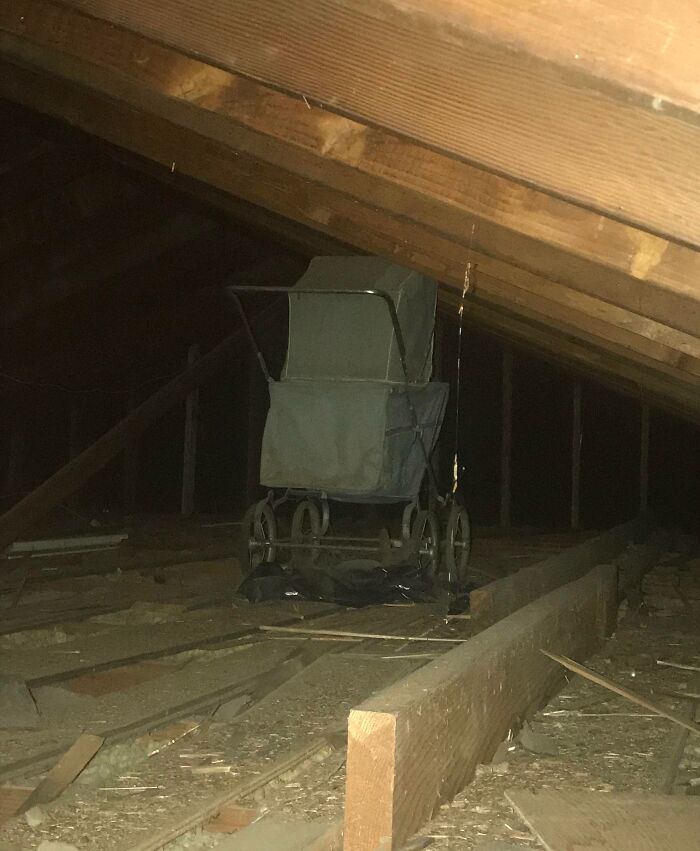 Vintage baby carriage found in an old attic, an interesting artifact from the past with historical charm.