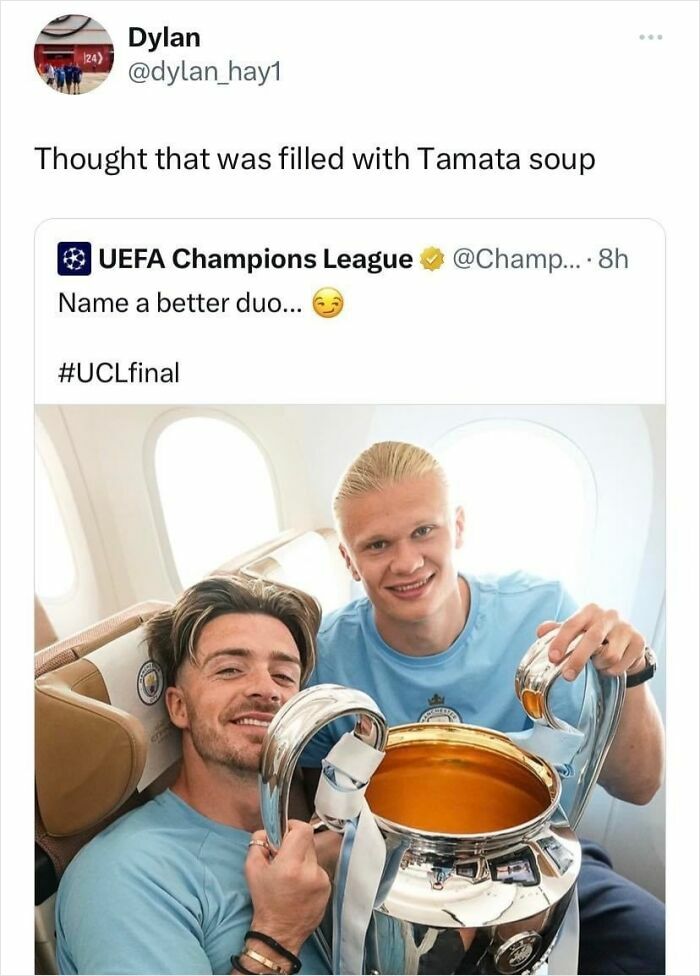 Two football players humorously holding a trophy on a plane, joking about it being filled with tomato soup. Scottish humor.