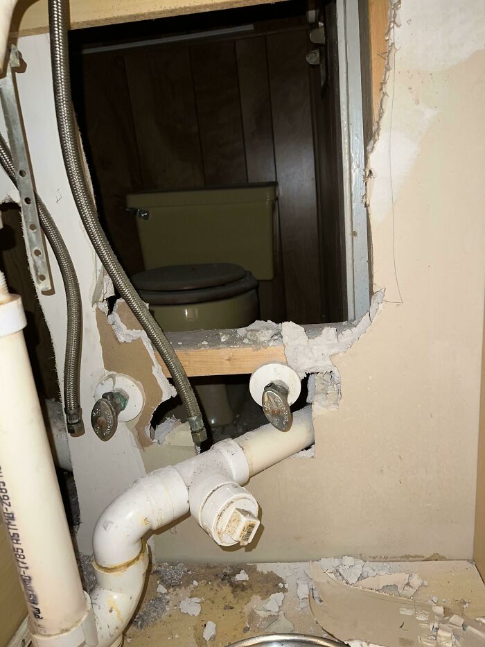 Hidden bathroom discovered behind a wall, showcasing an interesting artifact from the past in an old house.