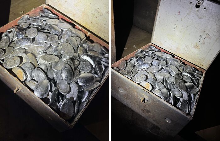 Old metal box filled with vintage artifacts found in a house.