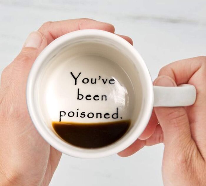 Coffee mug with prank message "You've been poisoned" at the bottom.