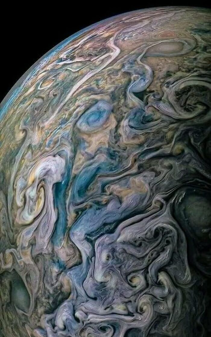 Swirling clouds on Jupiter creating an out-of-this-world cosmic pattern.