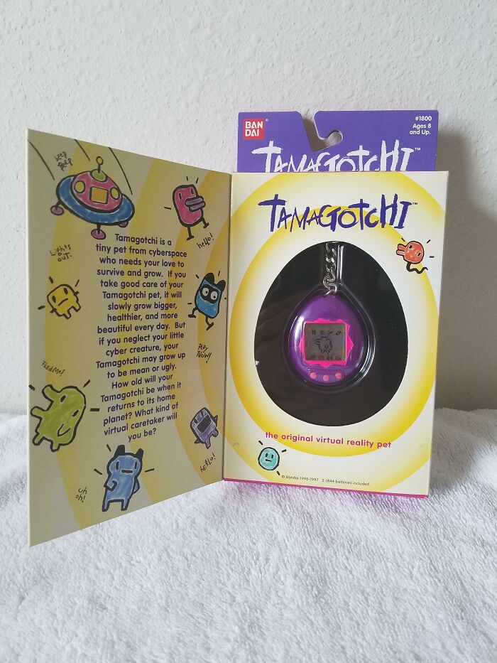 Purple vintage Tamagotchi in original packaging, showcasing collectible value.