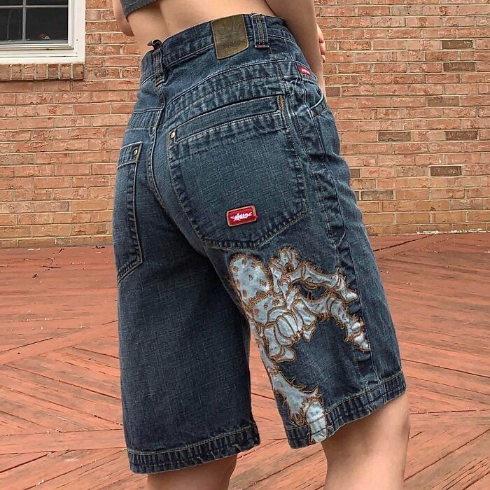 "Vintage denim shorts with unique embroidery, a style still valued for its retro appeal and collectible status."