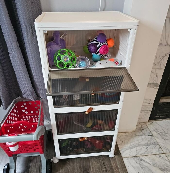Toy storage unit with colorful toys and a child’s shopping cart, illustrating bargain organization solutions.