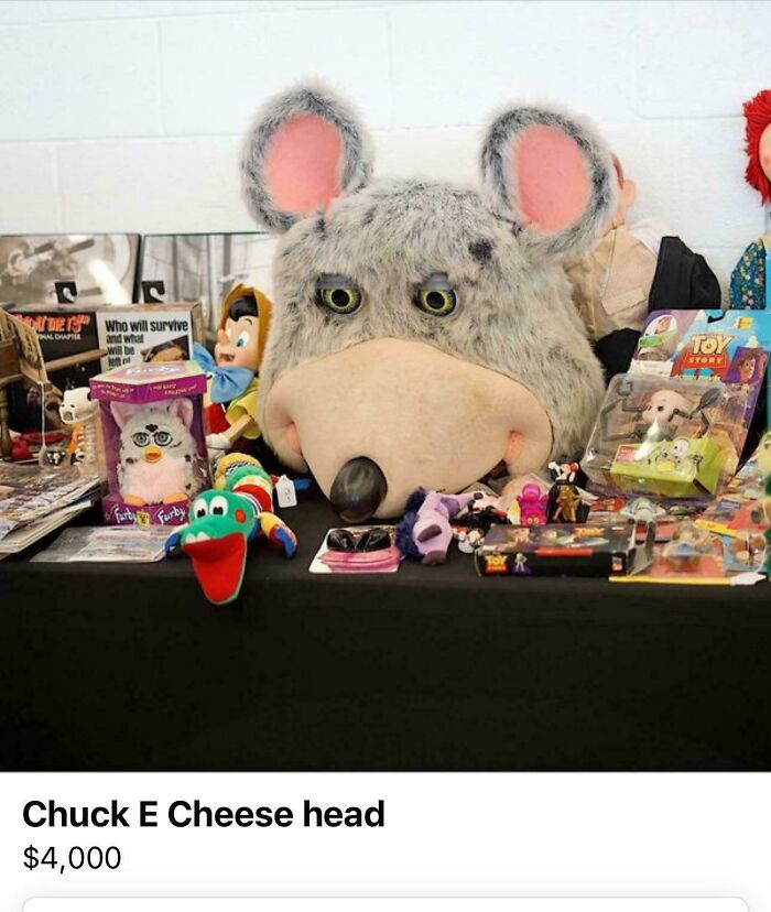 Chuck E. Cheese head on sale with vintage toys; unusual items listed on Facebook Marketplace.