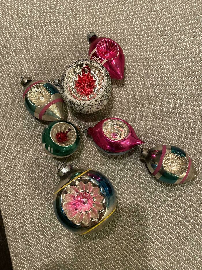 Vintage Christmas ornaments on display, showcasing colorful designs and reflecting nostalgic charm.