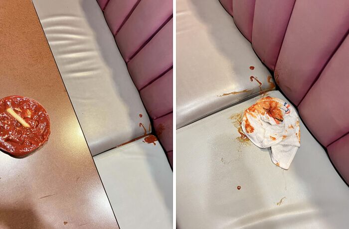 Sauce spilled on a restaurant booth seat with napkin cleaning up, depicting a worst day at work scenario.