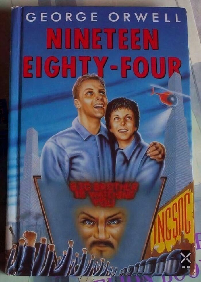 Unusual book cover for George Orwell's "Nineteen Eighty-Four," featuring smiling figures and stylized artwork.