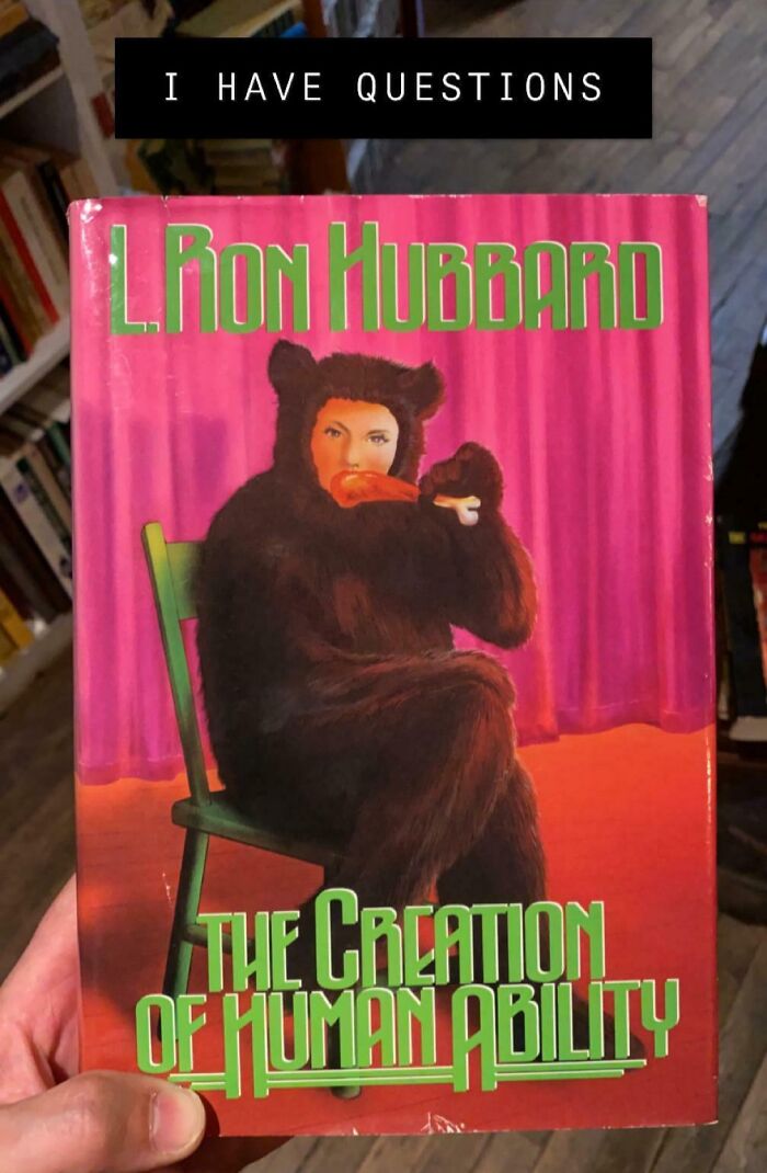 Terrible book cover featuring a person in a bear costume with a pink curtain backdrop.
