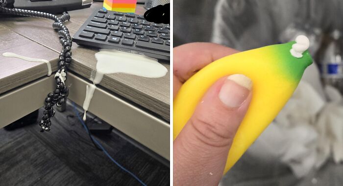 Spilled milk on desk near keyboard and leaking banana toy, showcasing a worst day at work scenario.