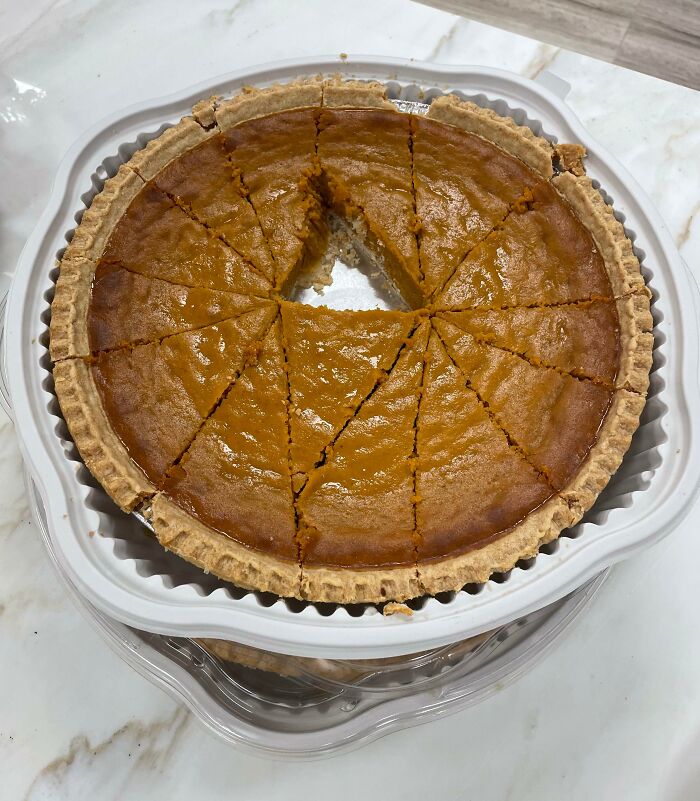 Pumpkin pie missing a slice, highlighting challenges with worst colleagues.