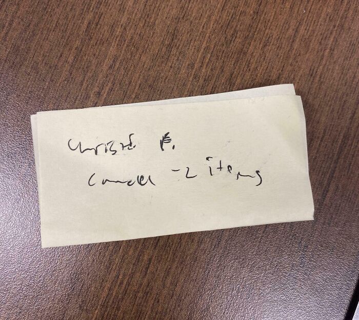 A handwritten note on a desk, showcasing a message from challenging colleagues.