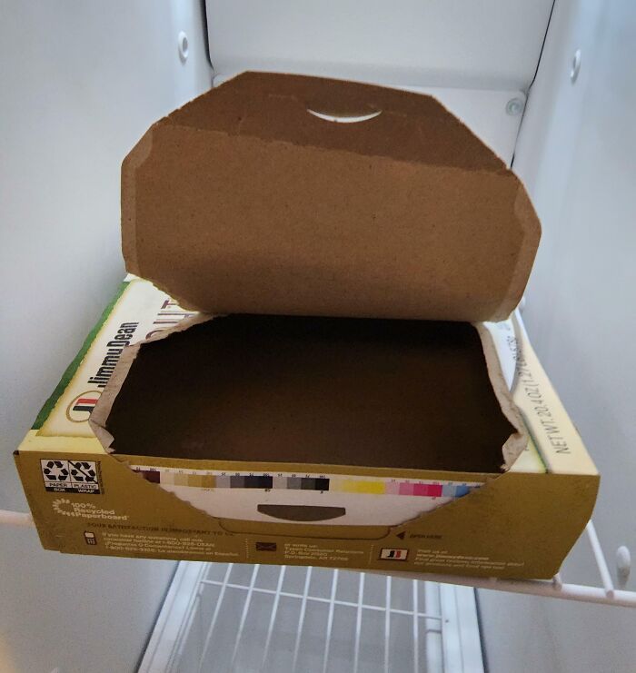 Empty pizza box left in freezer by inconsiderate colleagues.