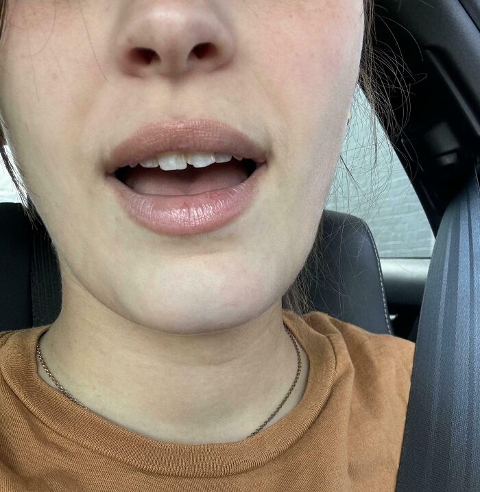 A surprised person in a car having the worst day at work.