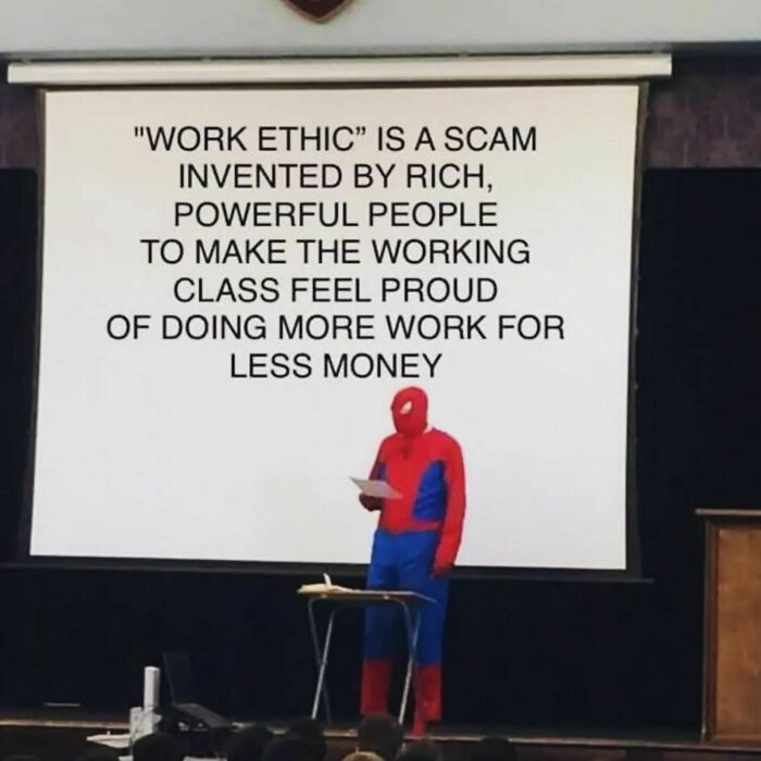 Person in Spider-Man suit giving presentation on work ethic as a hot take, in front of audience.