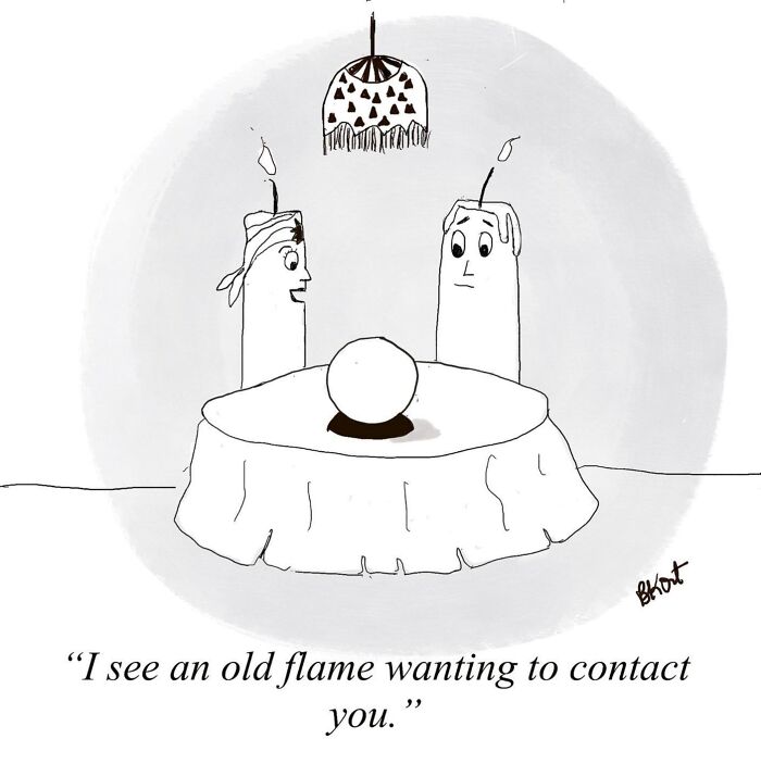 Two candles at a table with a crystal ball, humorously depicting a psychic reading.
