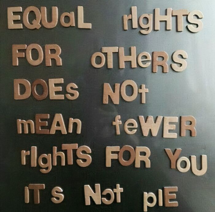 Magnetic letters on a fridge conveying a message about equal rights and fairness for all in a wholesome way.