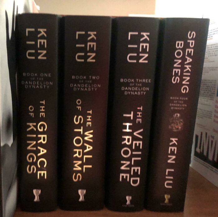Four book spines with misaligned titles, illustrating disastrous design work.