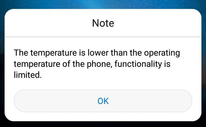 Phone temperature warning screen showing limited functionality, capturing a worst day at work scenario.