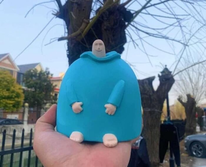Unique figurine in blue held outdoors, a find that makes people ask "Where did you get that?"