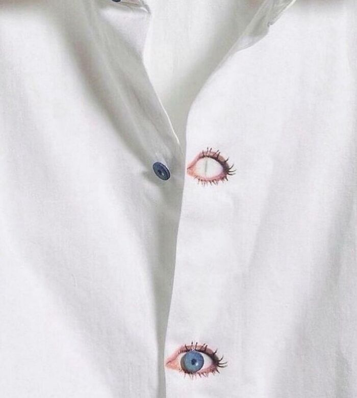 Shirt design with buttons resembling eyes, showcasing a disastrous design concept with eye illustrations.