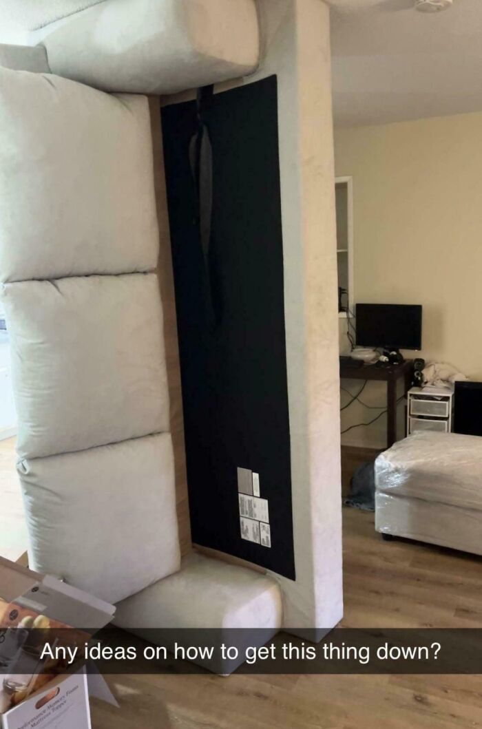 Upright couch stuck in a room, creating a challenging day.