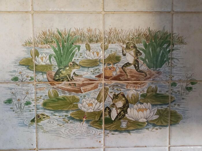 Frogs in illustrated scene with lily pads and boats, depicting mundane everyday activity.