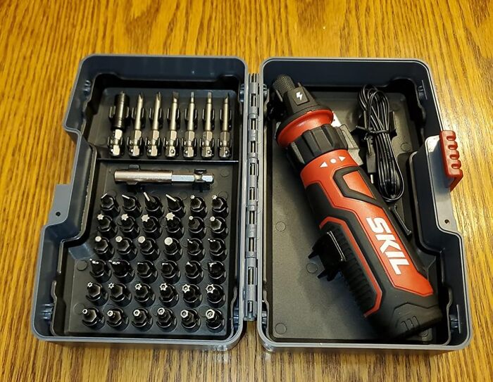 Electric toolset with screwdriver and bits, showcasing practical life skills equipment in an organized case.