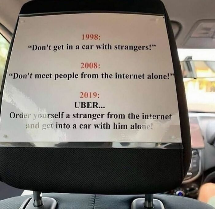 Car seat sign humorously highlights changes in stranger interactions from 1998 to 2019 for meme distraction.