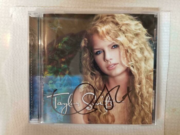 Autographed vintage album cover with a portrait of a female artist, highlighting its collectible value.