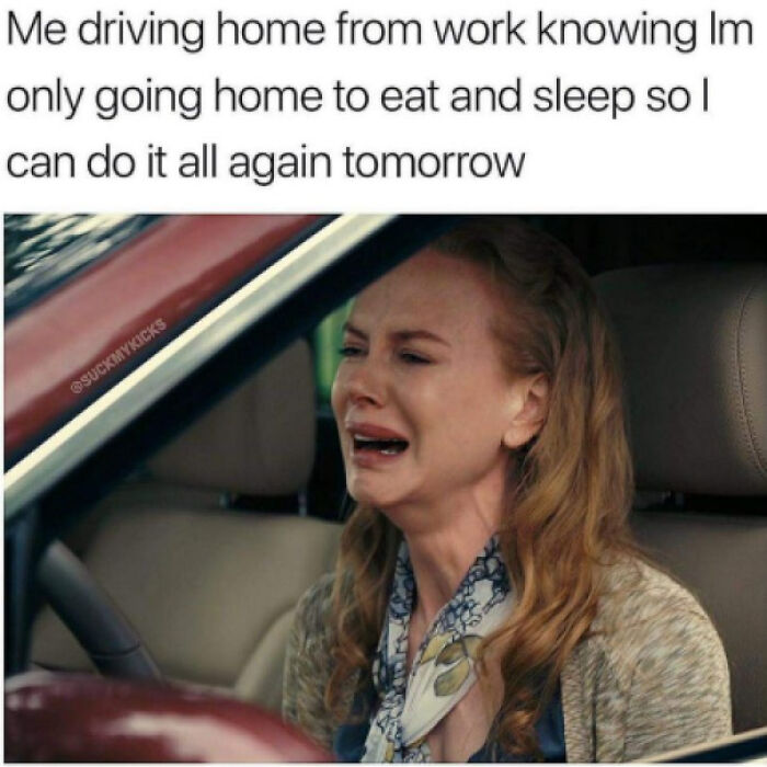 Woman crying in car after work, representing adulthood struggles.