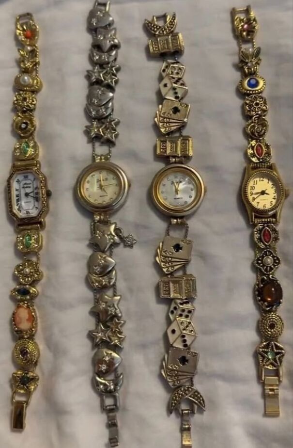 Five ornate, unusual watches found while thrifting, featuring intricate bracelet designs with various themed charms.