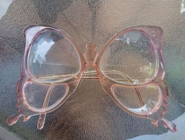 Unusual butterfly-shaped pink glasses found while thrifting.