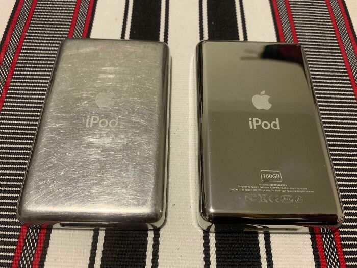 Worn-down iPod next to pristine one, highlighting effects of time on belongings.