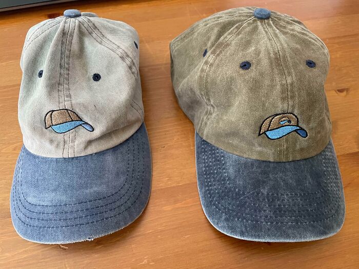 Two worn baseball caps side by side, showing the effects of time on their fabric.
