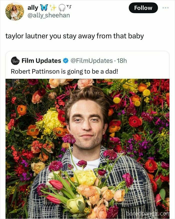 Man with flowers smiling, surrounded by colorful blossoms, portraying a wholesome moment.