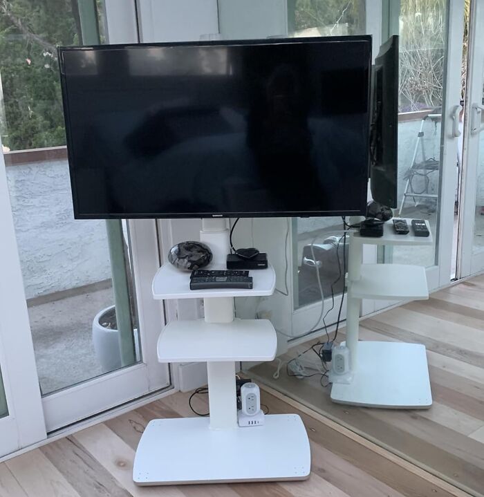 Modern TV stand with shelves optimizing small space, showcasing genius furniture solutions.